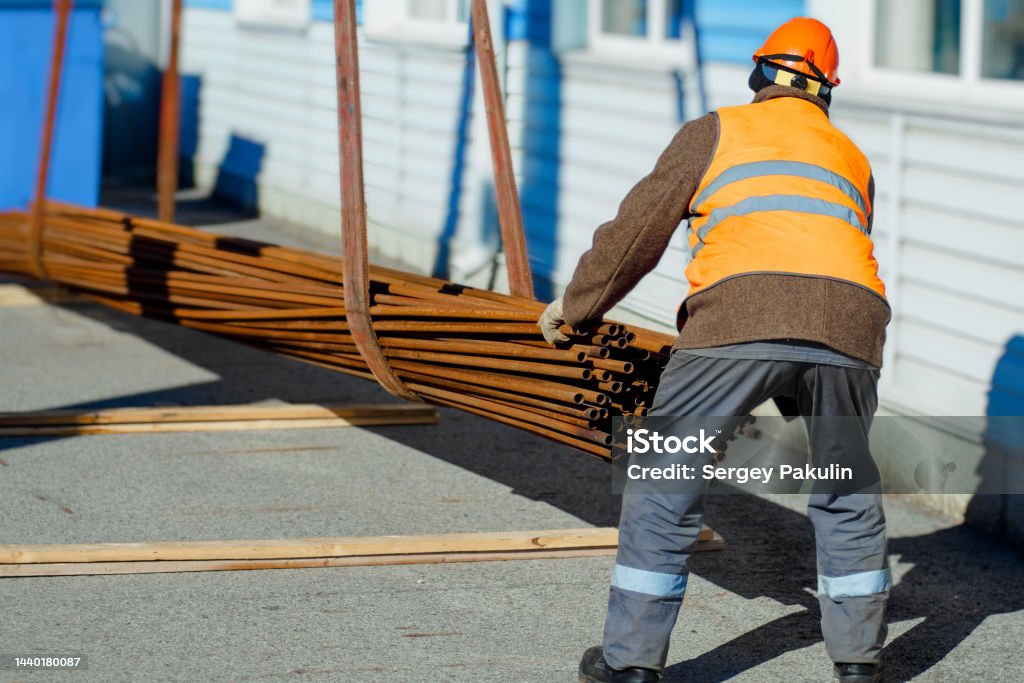 Stack Pipe Material Loading Slinger Stacks Thin Metal Pipes In Stack On Construction Site Closeup ...