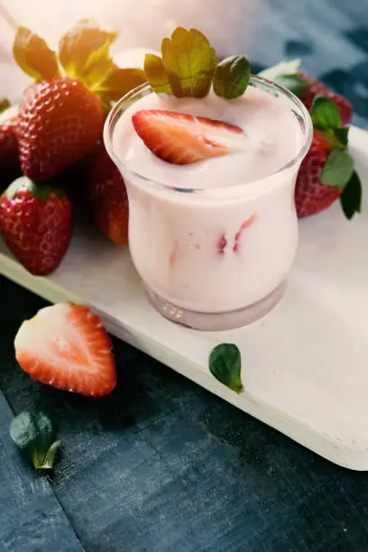 Healthy food of yogurt, Strawberry Yogurt,yogurt with fresh strawberry, wood background