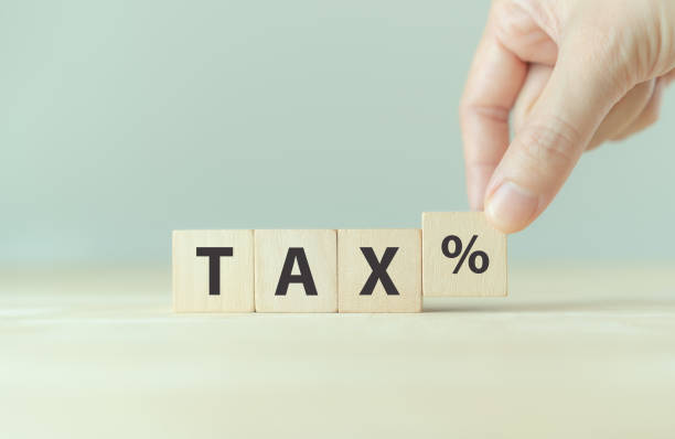 TAX concept, on wooden block. Including of state taxes,tax payment, governant ,calculating finance, tax accounting, statistics and data analytic reserach, calculation tax return, strategy plan, report concepto tax, sobre bloque de madera. incluyendo impuestos estatales, pago de impuestos, gobierno, cálculo de finanzas, contabilidad fiscal, estadísticas e investigación analítica de datos, cálculo de declaración de impuestos, plan estratégico, info