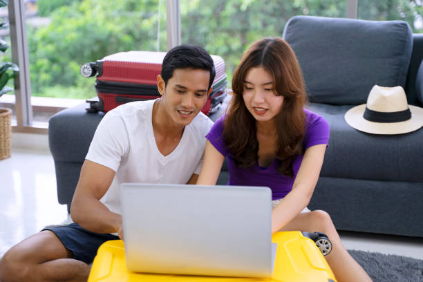 istock Young couple is preparing for travel. 1440183376