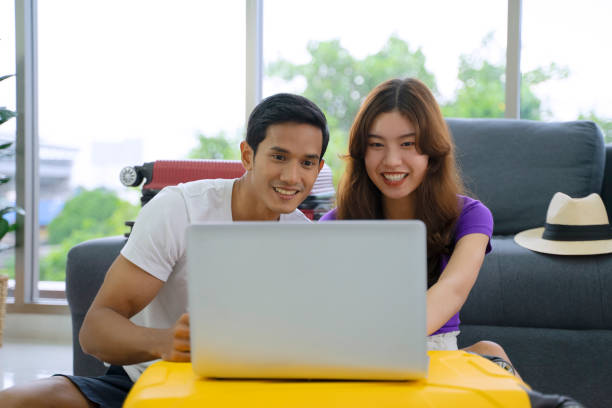 istock Young couple is preparing for travel. 1440183952