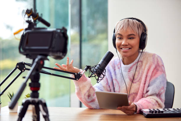 istock Female Vlogger Recording Music Keyboard Tutorial Video At Home With Camera 1440184004