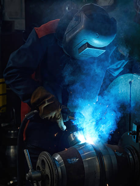 istock Vertical photo of a welder making a valve 1440186102
