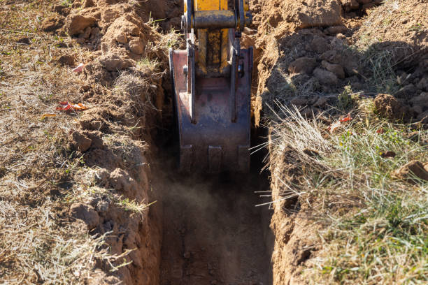 Excavator Digging a Trench for Foundation stock photo
