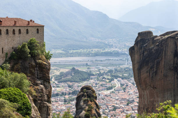 istock Kalambaka city panoramic view opens in the crevice between the rocks on which The Monastery of St. Stephen is located, entire valley, Meteora, Greece 1440187349