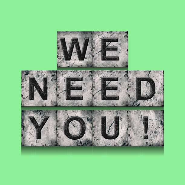 istock We Need You. Word on stone blocks. Isolated on a green background. Design element.Lifestyle. 1440187740