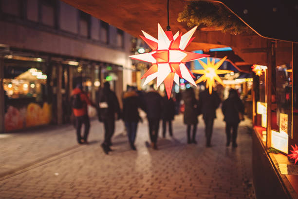 Illuminated poinsettia at the Christmas market in Germany stock photo