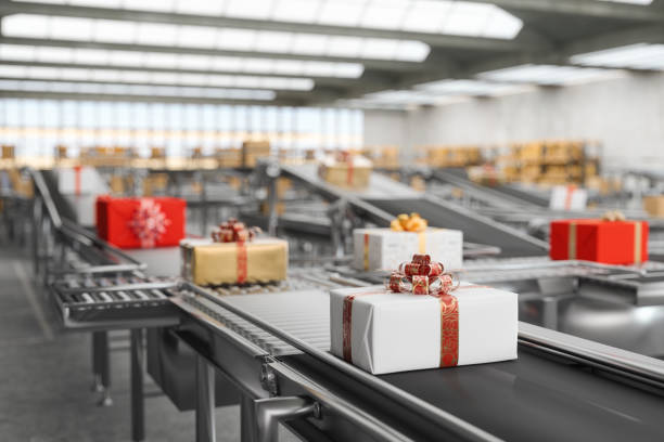 Close-up View Of Gift Boxes On Conveyor Belt With Blurred Background