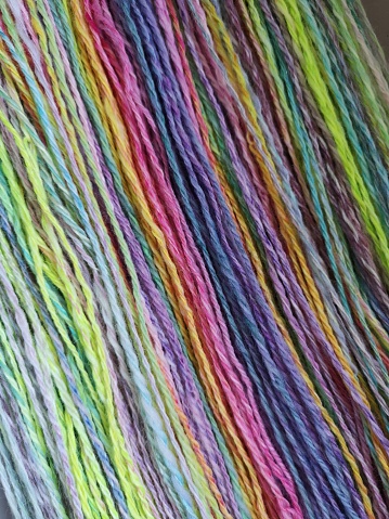 Samples of handdyed skein of different sheep wool fibres for spinning art yarn for knitting