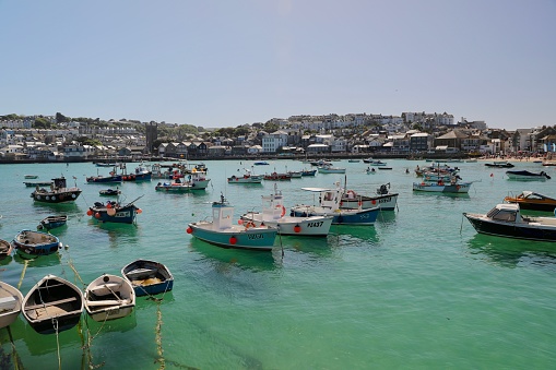Panorama across Brixham Harbour with boats moored
