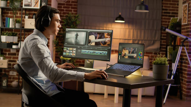 istock Asian man listening to music and editing video on software 1440191883