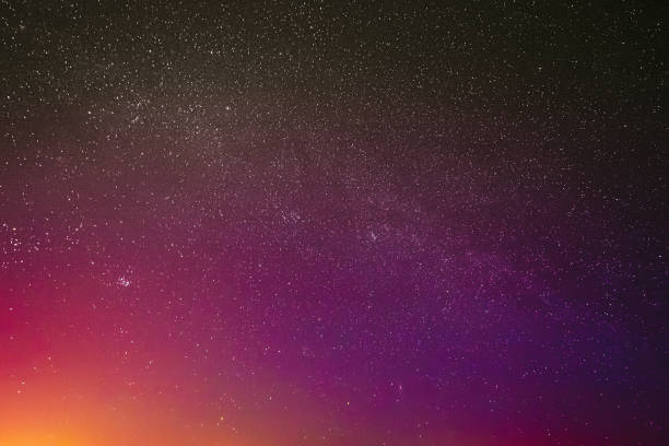 istock Night Sky Glowing Stars Background Backdrop. Colorful Sky Gradient. Sunset Sunrise Dawn Lights And Colourful Night Starry Sky In Yellow Pink Magenta Orange Purple Colors 1440191995
