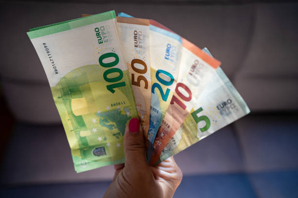 Woman holding euro banknotes