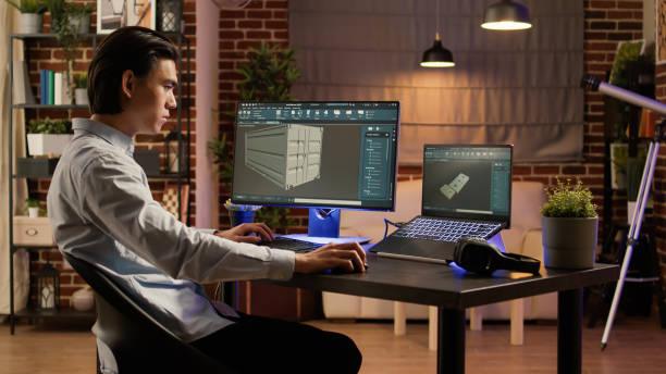 istock Asian engineer manufacturing industrial product on pc software 1440194356