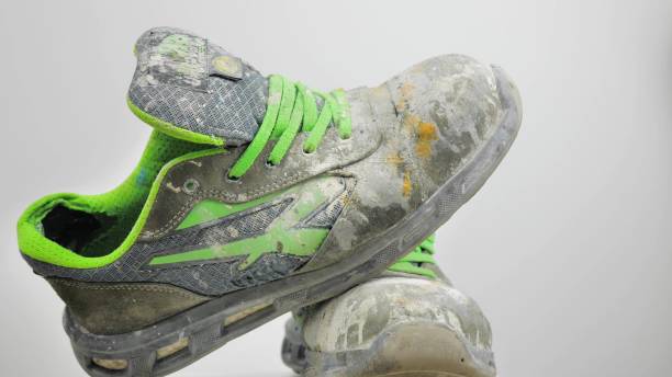 istock Dirty shoes spin on a turntable. on a white background 1440194797