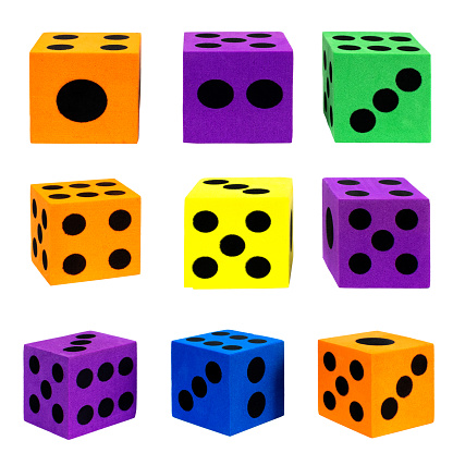 Collection of colorful foam dice, isolated.