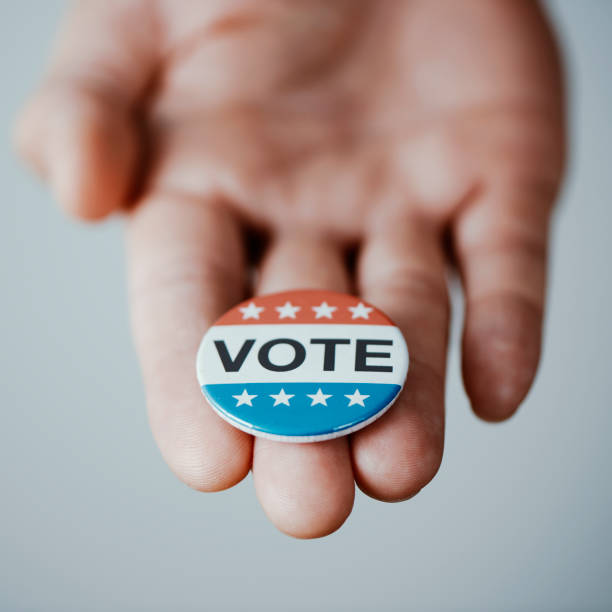 istock man with a vote badge for the US election 1440197169