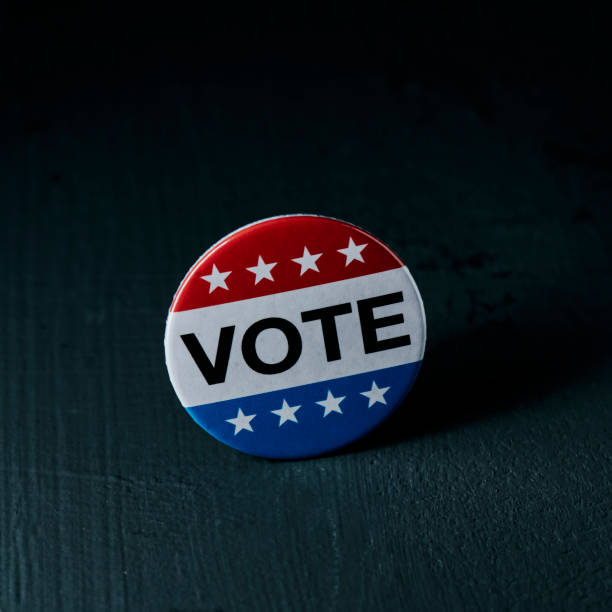 istock badge for the US election on a gray surface 1440197192