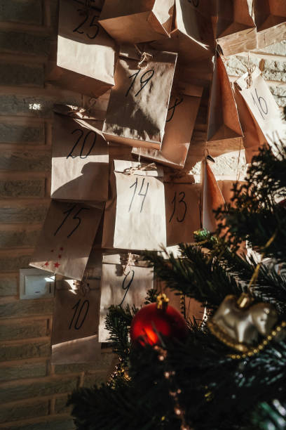 istock Advent calendar with small gifts in sun light. 1440197553
