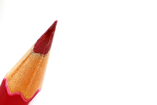 A red pencil or paint on a white background