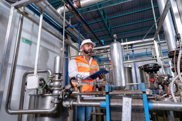 istock Mechanical engineer inspection pipe tube connection commissioning ready for plant startup machine 1440208401