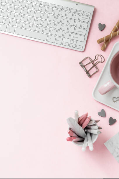 istock A feminine workspace, keyboard of a computer on pink background with copy space 1440208597