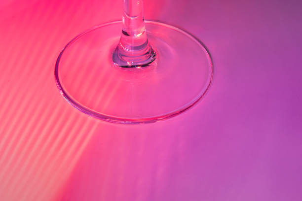 istock Abstract background - stem of the glass and falling neon rays. close up 1440208818