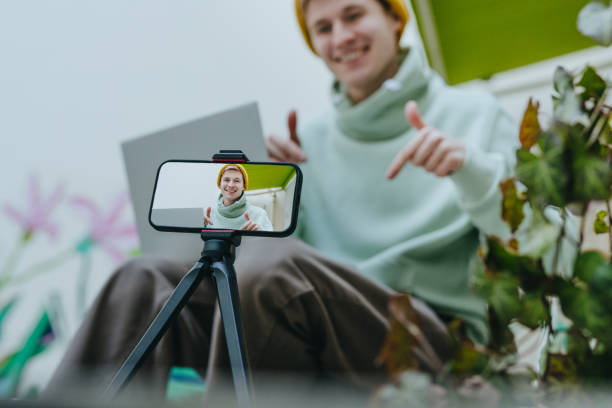 istock Young man blogger making vlog using smartphone outdoor 1440213070
