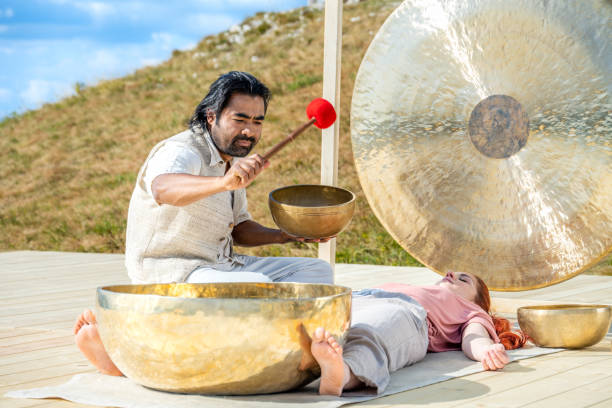 istock Sound therapy, traditional tibetan meditation session, front side view 1440215581