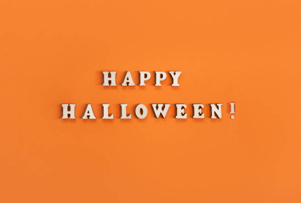 istock Halloween card on orange background. Banner for congratulations or invitation. 1440216294