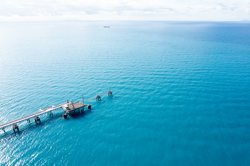 Aerial view of commercial dock. Oil industry logistics and transportation. Energy import export business.