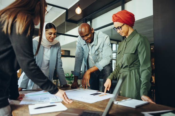 istock Innovative interior designers brainstorming in an office 1440217921