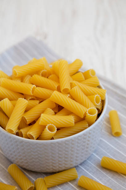 istock Dry Rigatoni Pasta in a gray Bowl, side view. 1440219803