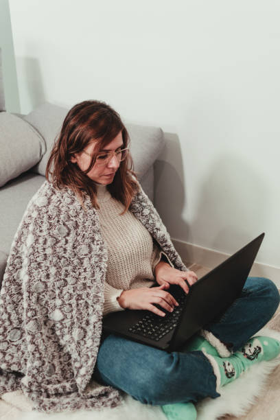 istock woman working with her laptop at home 1440221422