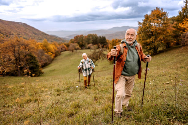 istock Senior hikers enjoying a walk together 1440223338