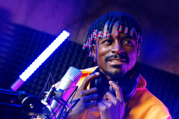 istock Young African performer recording his new track in recording studio 1440228450