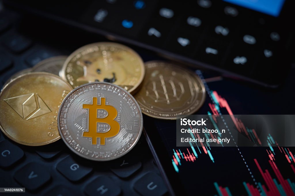 Bitcoin and Ethereum cryptocurrency with candle stick graph chart, laptop keyboard, and digital background Gold Bitcoin and Ethereum cryptocurrency coins with candle stick graph chart, laptop keyboard, and digital background. Cryptocurrency Stock Photo