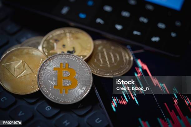 Bitcoin And Ethereum Cryptocurrency With Candle Stick Graph Chart Laptop Keyboard And Digital Background Stock Photo - Download Image Now