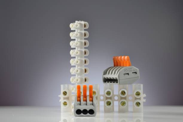 istock Composition of electrical terminal blocks of various types. Gray gradient background. Close-up. 1440241716