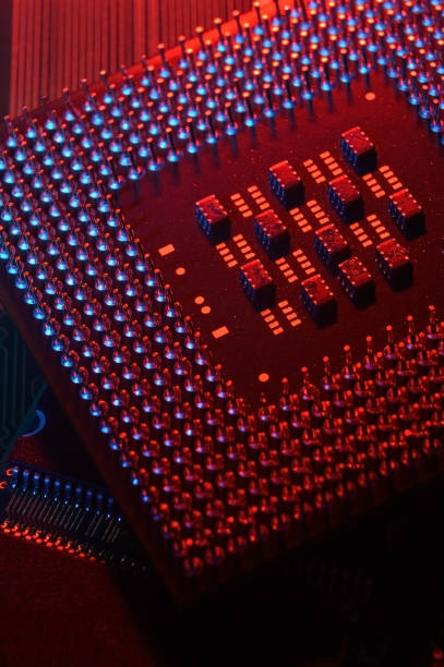istock Computer cpu processor chip on circuit board ,motherboard background. Close-up. With red-blue lighting. 1440243212