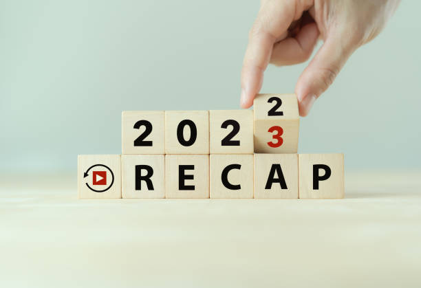 2022 Recap economy, business, financial concept. Business plan in 2023.  RECAP words, 2022 and 2023 on wooden cubes on smart grey background and copy space. 2022 Recap economy, business, financial concept. Business plan in 2023.  RECAP words, 2022 and 2023 on wooden cubes on smart grey background and copy space. replay photos stock pictures, royalty-free photos & images