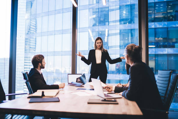 istock Group of main shareholders solving problems with corporate investment cooperating on brainstorming meeting, male and female partners analyzing productive strategy searching briefing solutions 1440245022