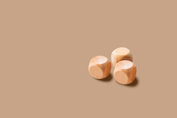 istock Blank wood cube block on cream color isolated background with copy space minimalist style 1440245467