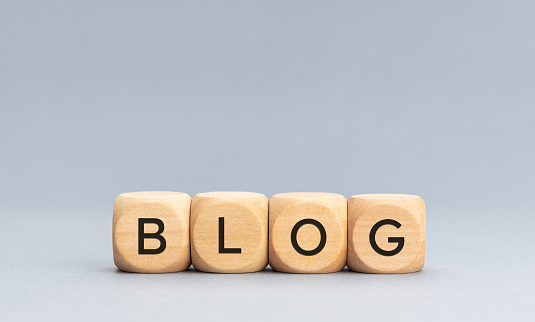 BLOG word on wooden cube blocks on gray background