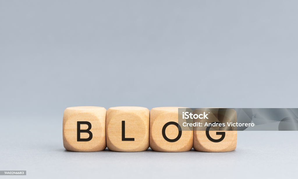 BLOG word on wooden cube blocks on gray background BLOG word on wooden cube blocks on gray background. Copy space Blogging Stock Photo