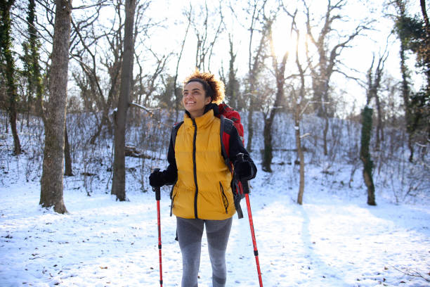 istock Young woman hiking on snow 1440249273