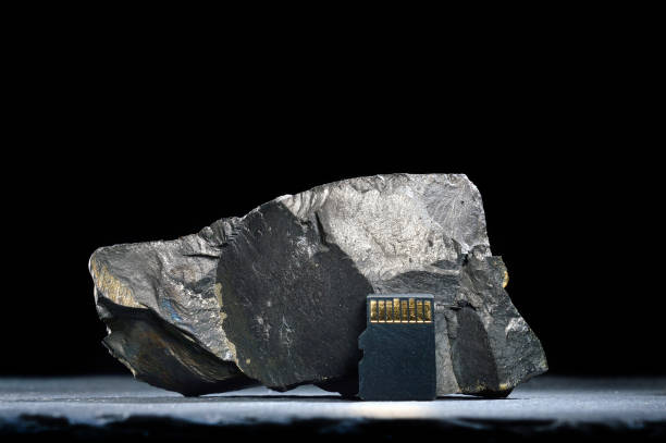 istock Composition of micro sd cards and dark stones. close-up. 1440249464