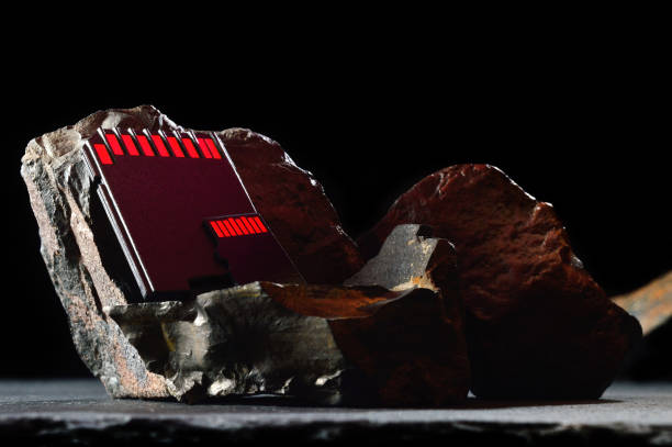 istock Composition of micro sd cards and dark stones. close-up. 1440249497