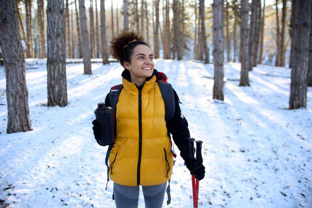 istock Young woman hiking on snow 1440249503