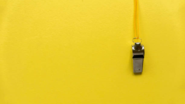 istock Whistle hanging on a yellow wall. 1440253188